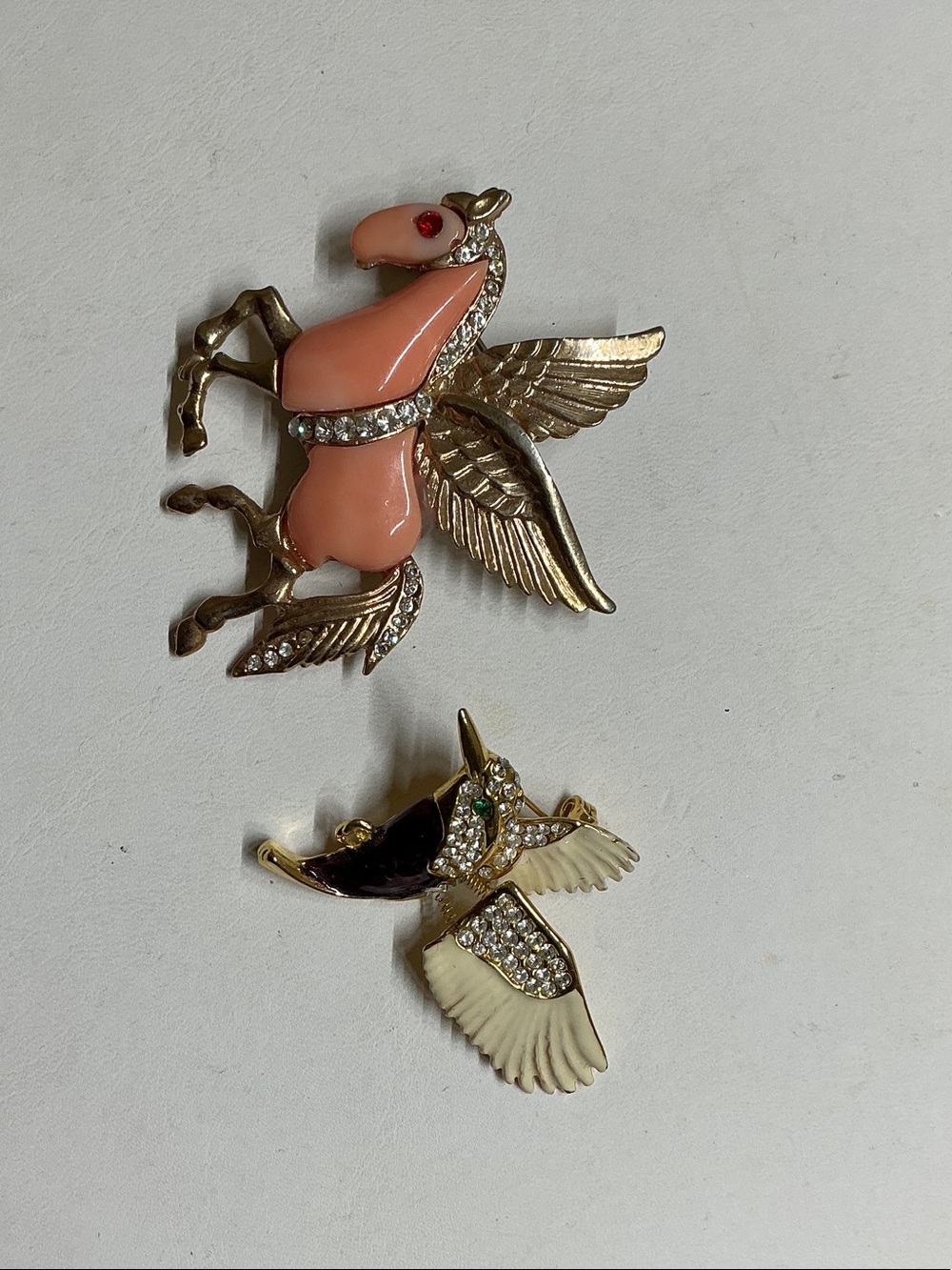 Hummingbird and Pegasus brooch.